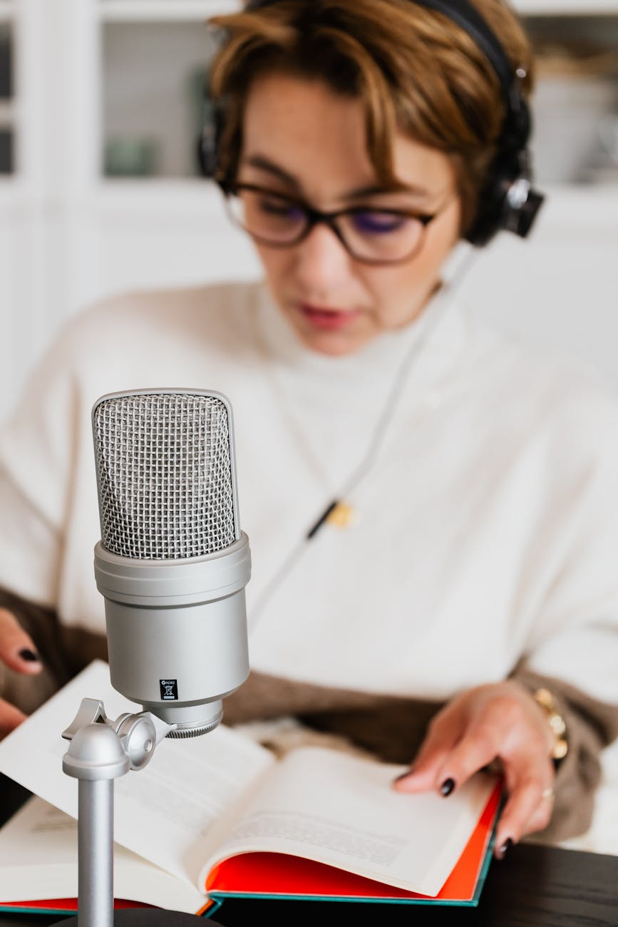 Woman speaking into a microphone, using voice technology for productivity